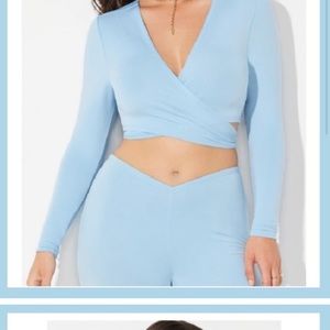 Camille Kostek Collection 
Baby Blue long sleeve dual look tie crop top